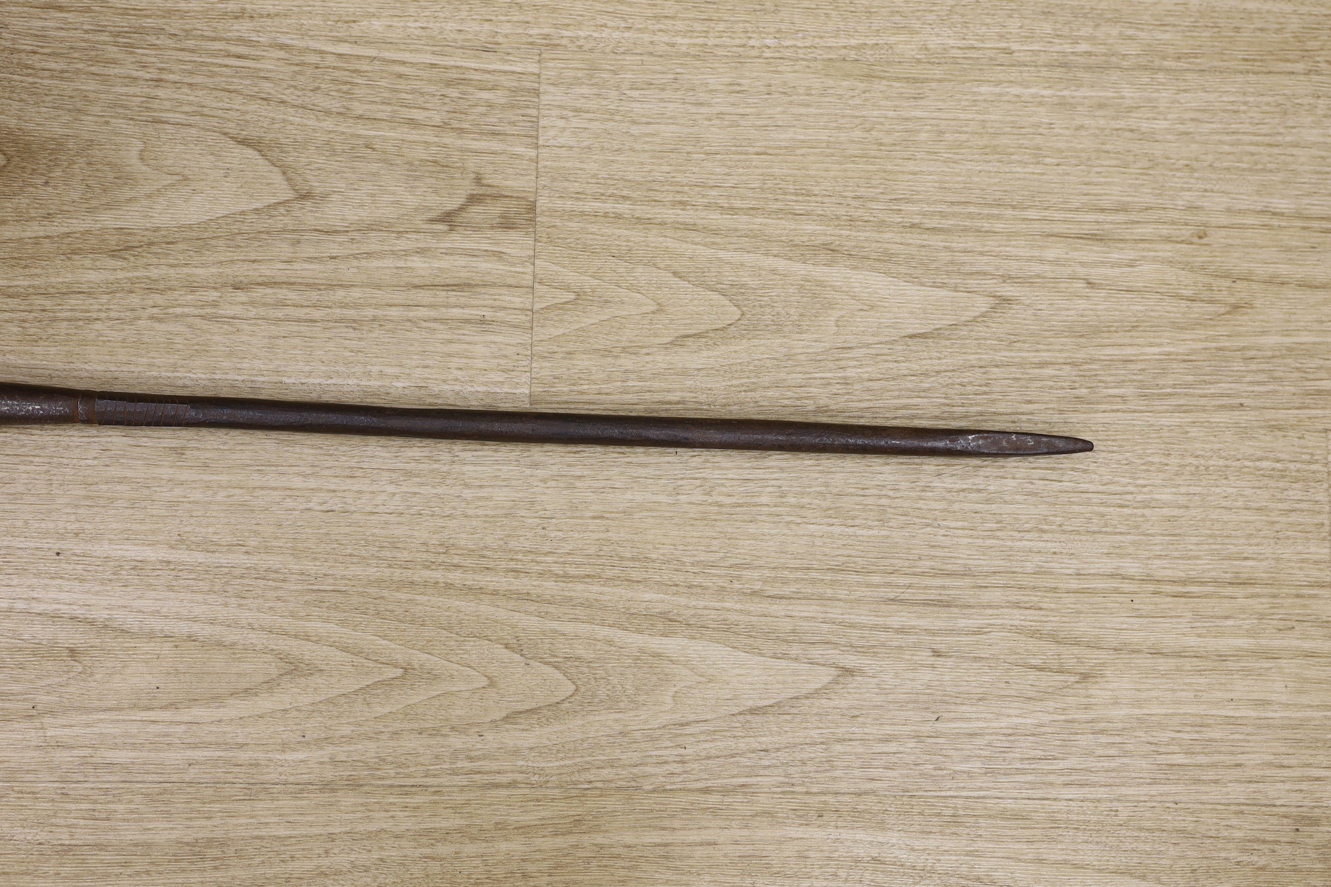 An African Boule crouched tribal figure, together with a spear, 156cm long